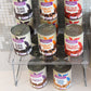 Clear plastic elevated storage rack holding several cans of food