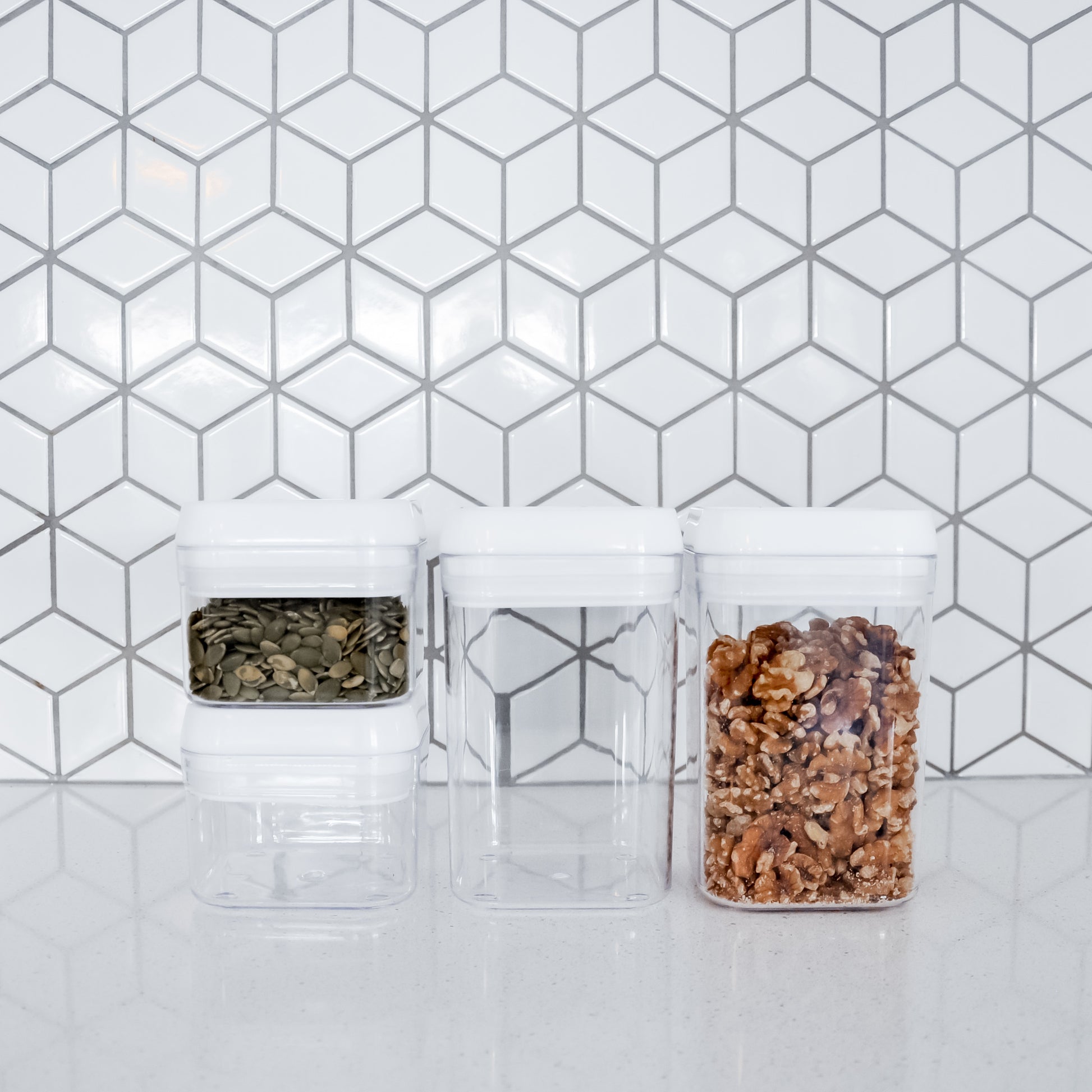 Four flip lock containers of various sizes